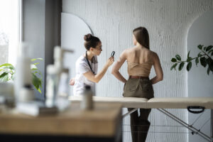 female-doctor-diagnosing-melanoma-body-female-patient (1)